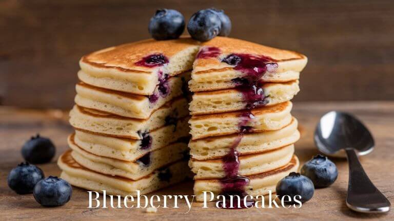 Whip up the fluffiest Homemade Blueberry Pancakes with this simple recipe! Great for breakfast, brunch, or even pancakes for dinner, these are a family favorite bursting with fresh berry flavor. #FluffyBlueberryPancakes #BestBlueberryPancakes #BlueberryPancake