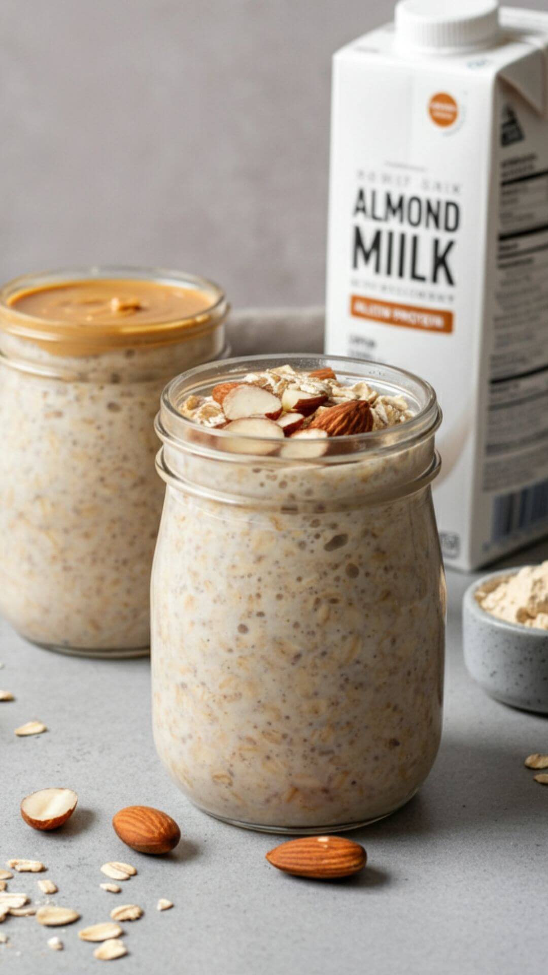 Glass jar filled with creamy peanut butter protein overnight oats, topped with banana slices, chia seeds, and a drizzle of peanut butter, sitting on a rustic wooden table for a wholesome breakfast vibe.